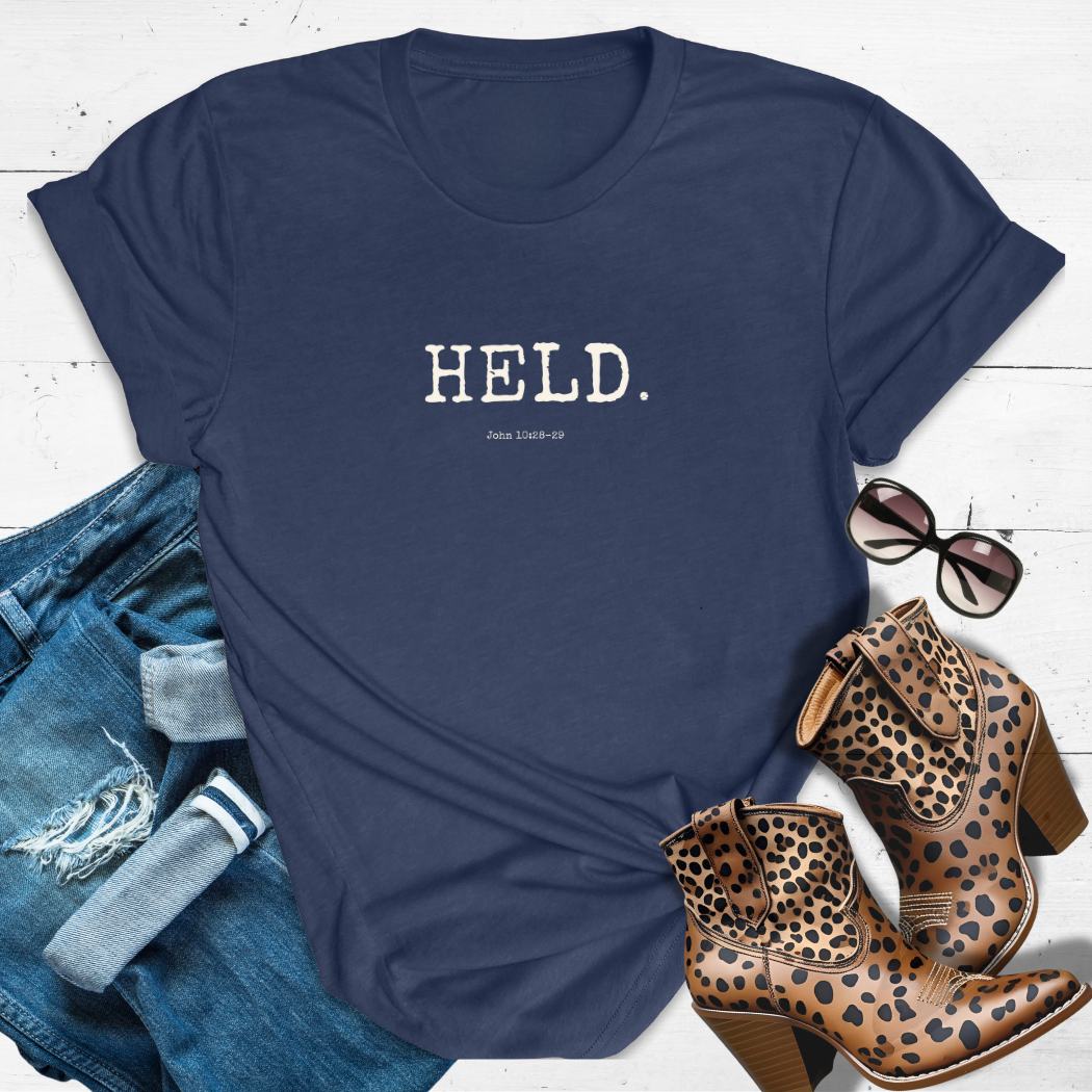 HELD.™ Tee – Safe in His Hands