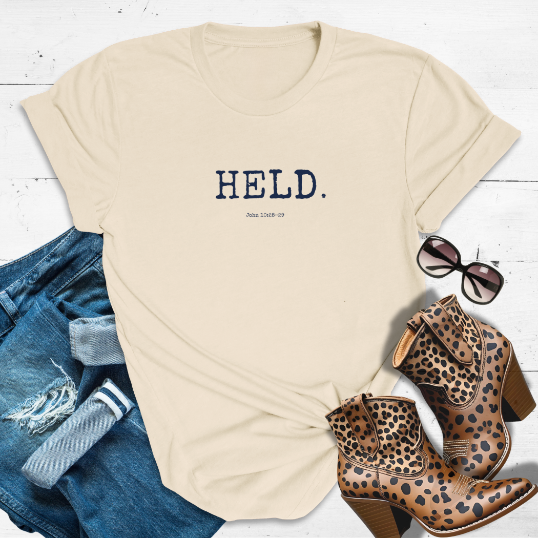 HELD.™ Tee – Safe in His Hands