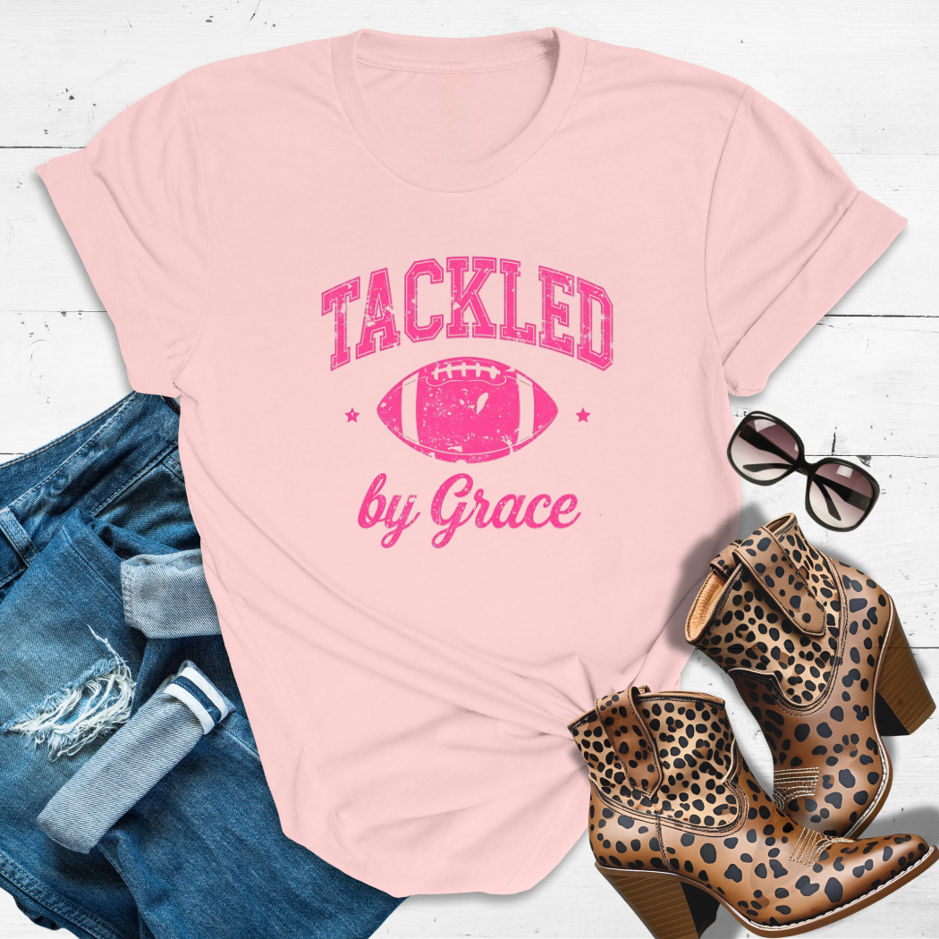 TACKLED BY GRACE.™ Tee
