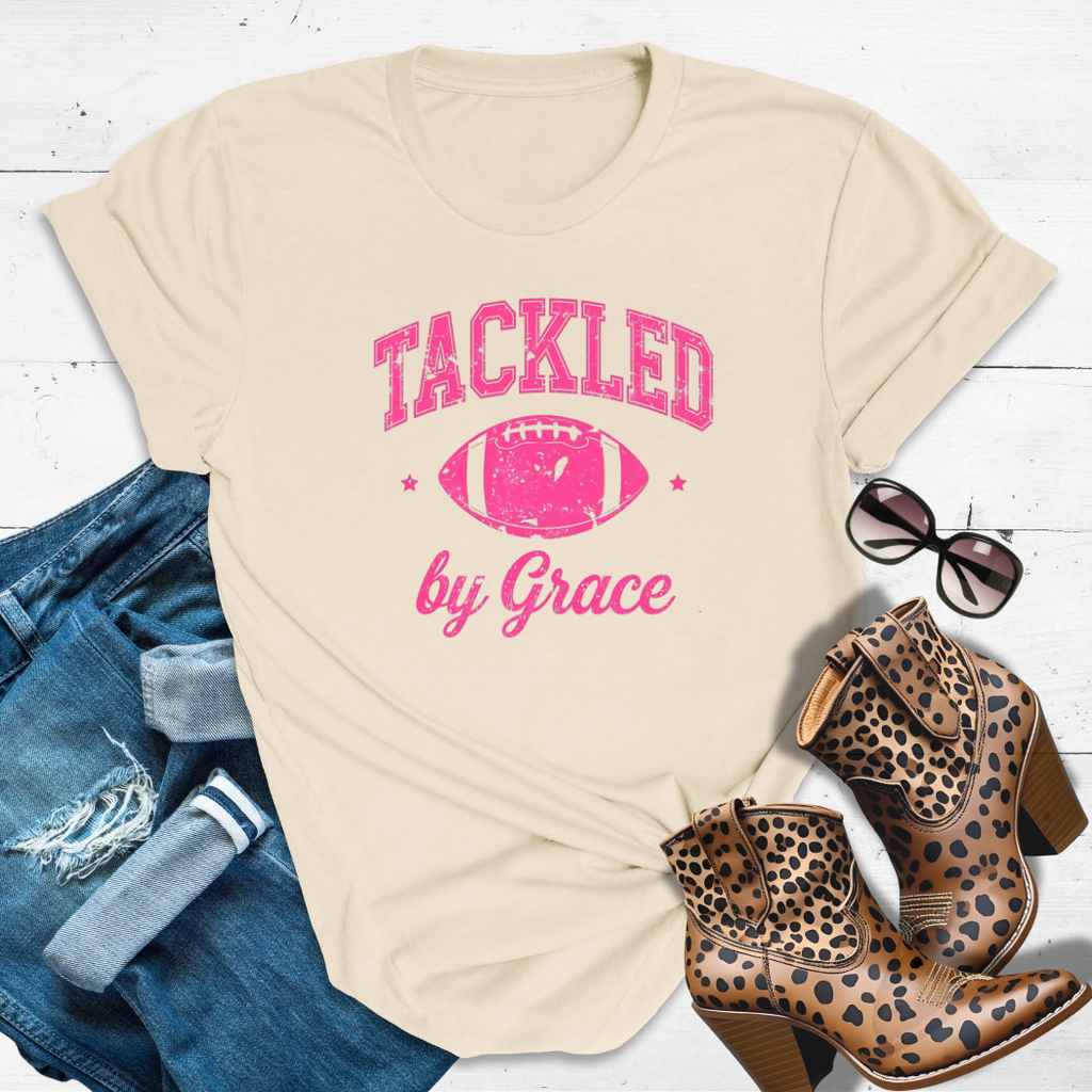 TACKLED BY GRACE.™ Tee