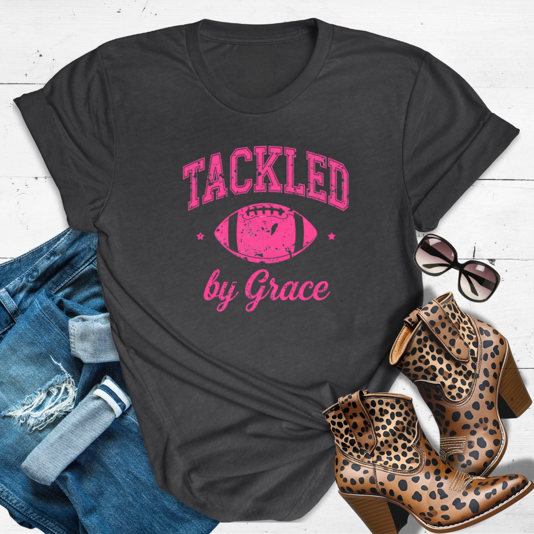 TACKLED BY GRACE.™ Tee