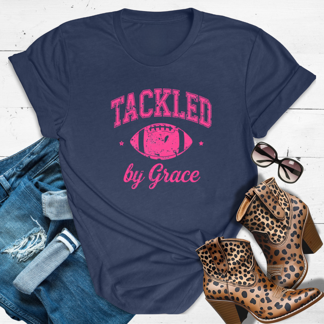 TACKLED BY GRACE.™ Tee