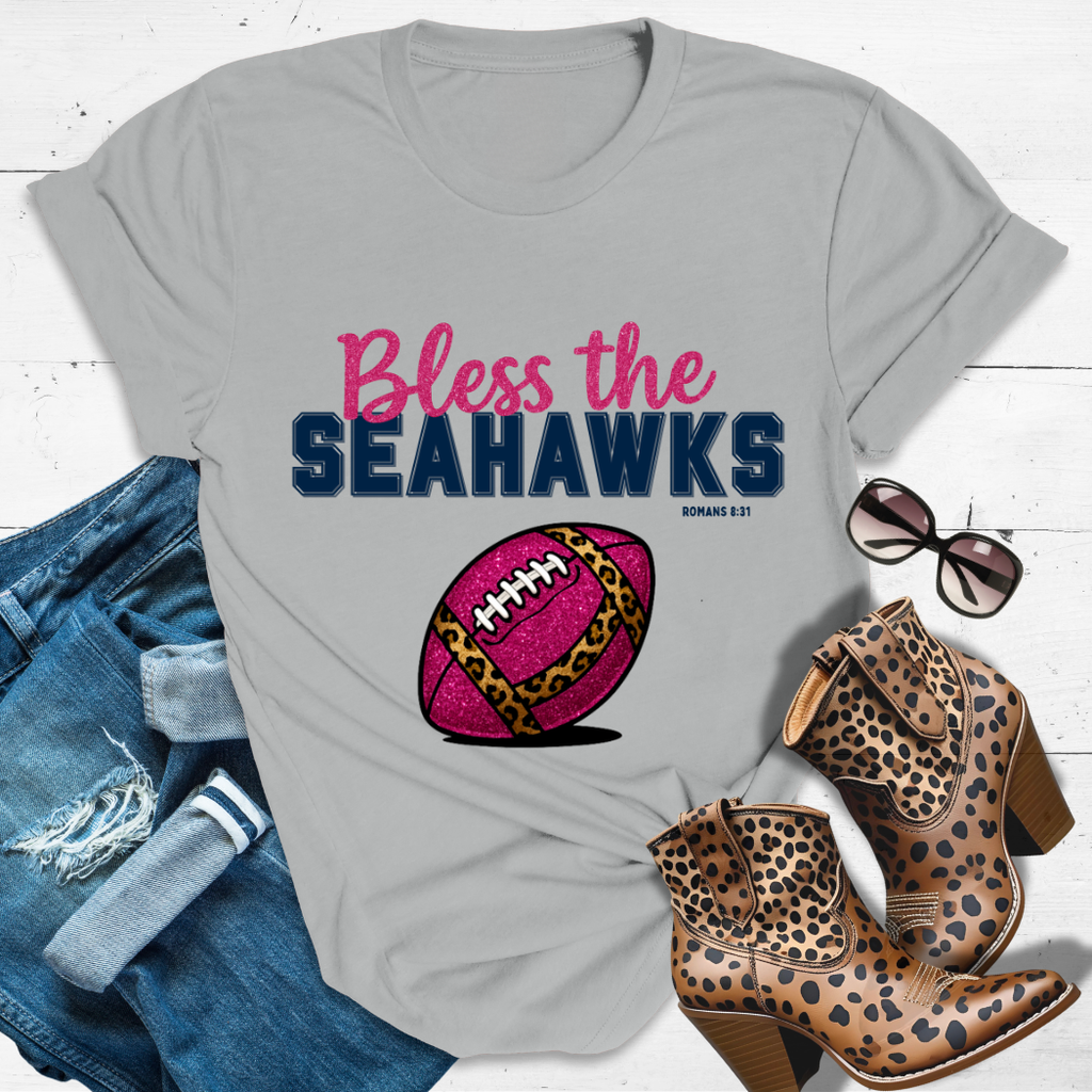 BLESS THE SEAHAWKS.™ Tee — Heaven’s got favorites — and she’s loud in the stands.
