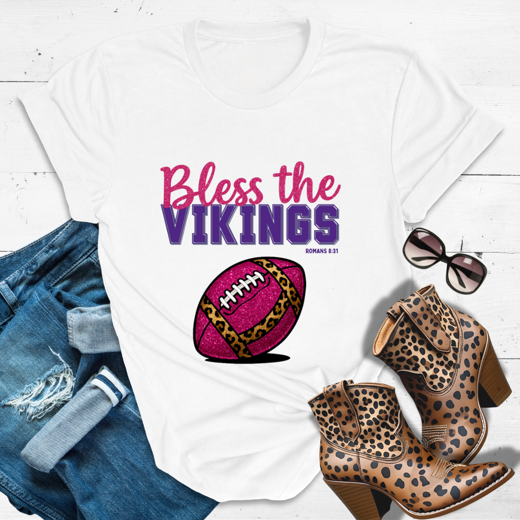 BLESS THE VIKINGS™ Tee — Heaven’s got favorites — and she’s loud in the stands.