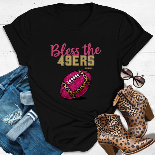 BLESS THE 49ERS™ Tee — Heaven’s got favorites — and she’s loud in the stands.