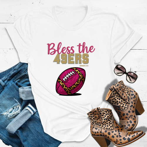 BLESS THE 49ERS™ Tee — Heaven’s got favorites — and she’s loud in the stands.